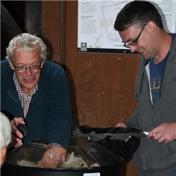 Gareth and Peter remove the egg boxes from the trap and catch the moths for identification Gareth and Peter remove the egg boxes from the trap and catch the moths for identification