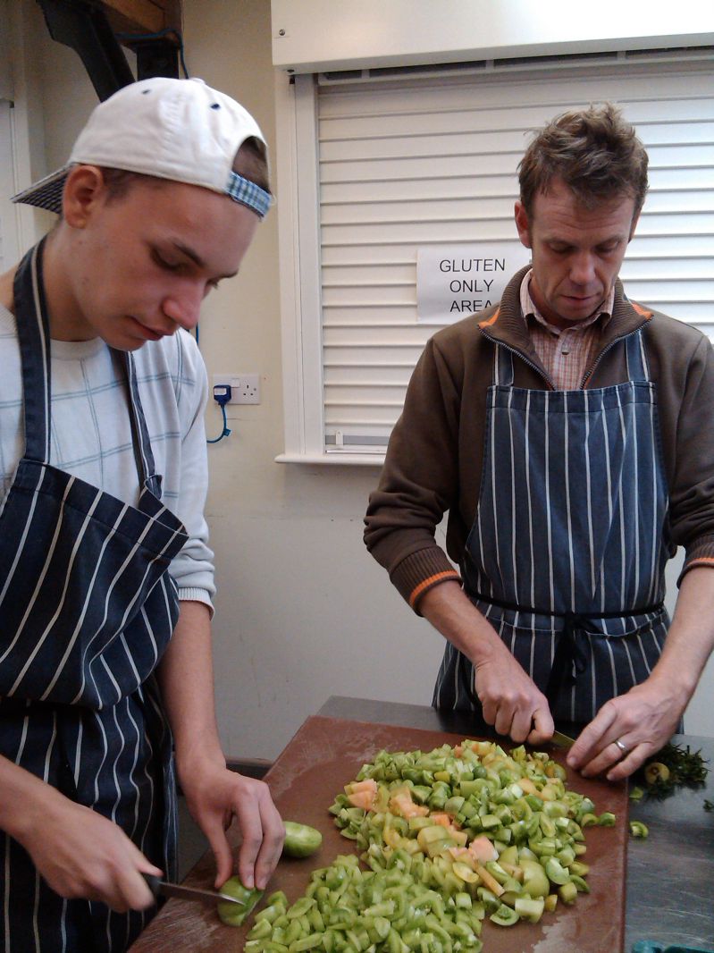 staff and young person makng chutney