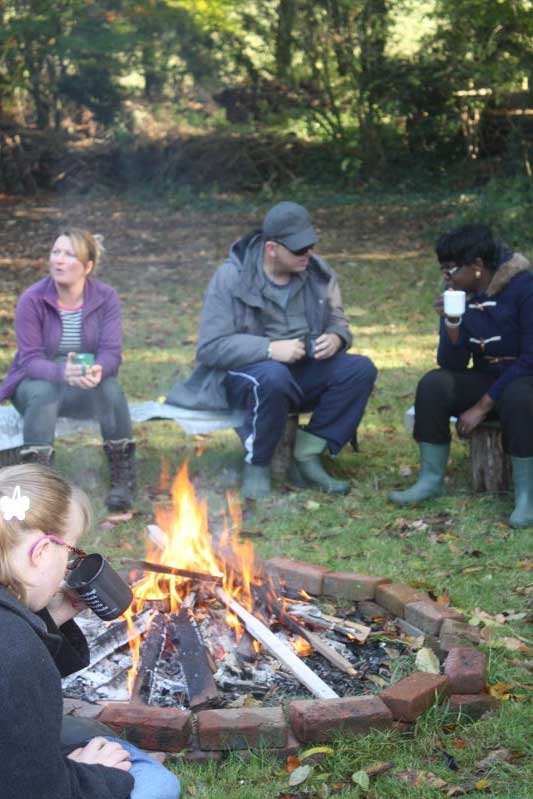 Kathys group round campfire in garden